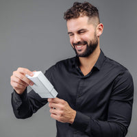Thumbnail for Man in a black shirt excitedly opening a gift box, celebrating the moment - Classic Photo Bracelet by Brother & Sisters.