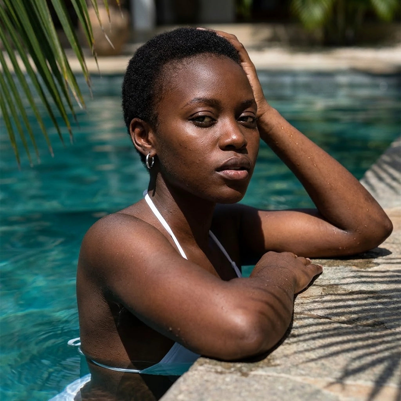 Everyday Waterproof Hoops in Silver, worn by a tropical pool | SKU: 41001-silver