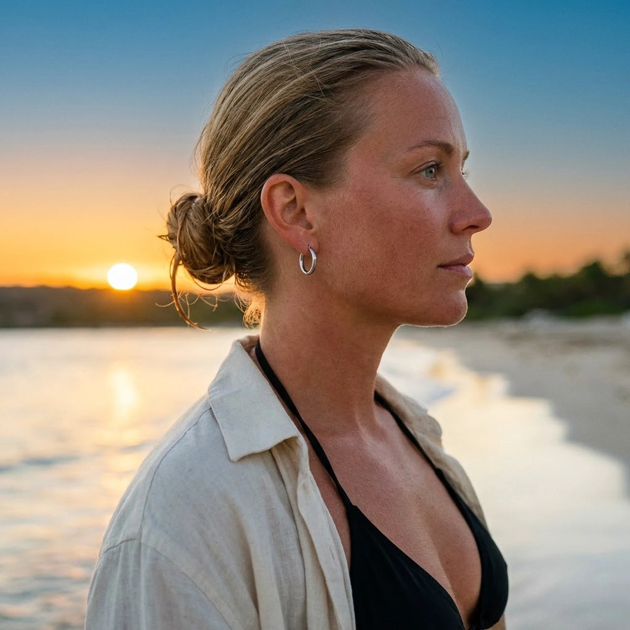 Everyday Waterproof Hoops in Silver, worn on the beach | SKU: 41001-silver