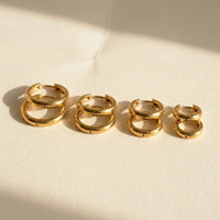 Thumbnail for Huggie Hoop Earrings Set of 4 Pairs in Gold, studio packshot of the pair on a plain background | SKU: huggie-set-gold
