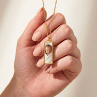 Thumbnail for Gold bar pendant held between two fingers, real small size, newborn photo inside | SKU: TPH-BARN-GOLD