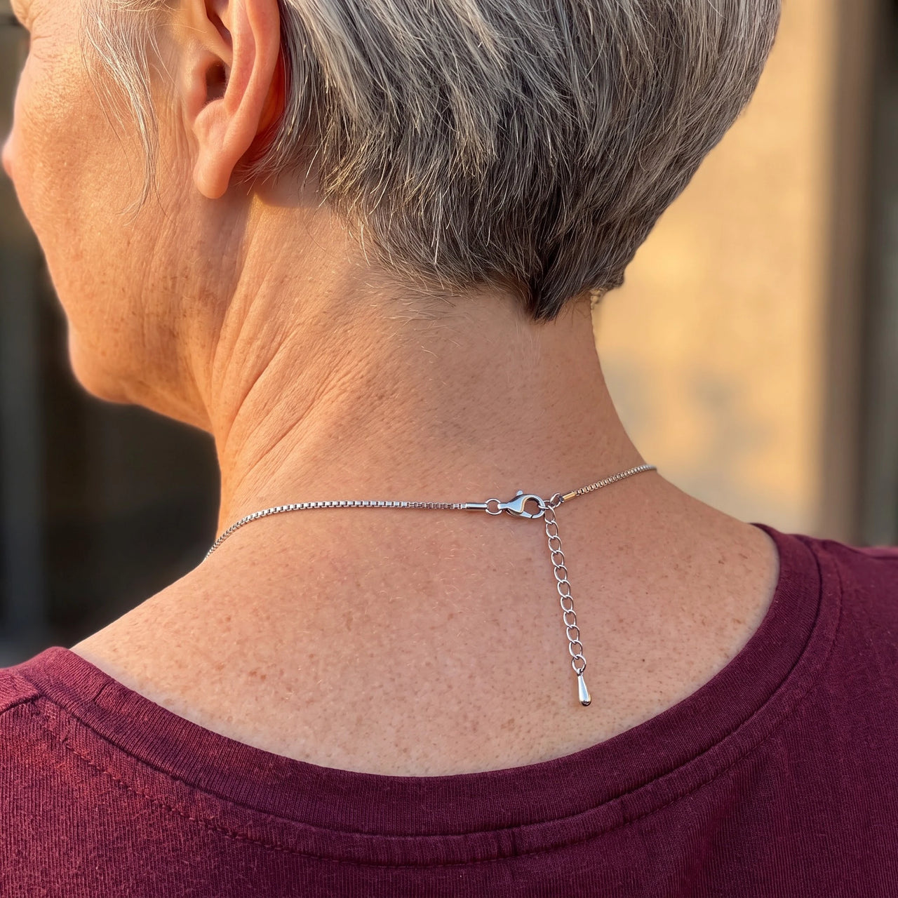 Back of the neck showing the lobster clasp and extension chain of the silver heart photo necklace | SKU: TPH-CHTN-SILVER-SMALL