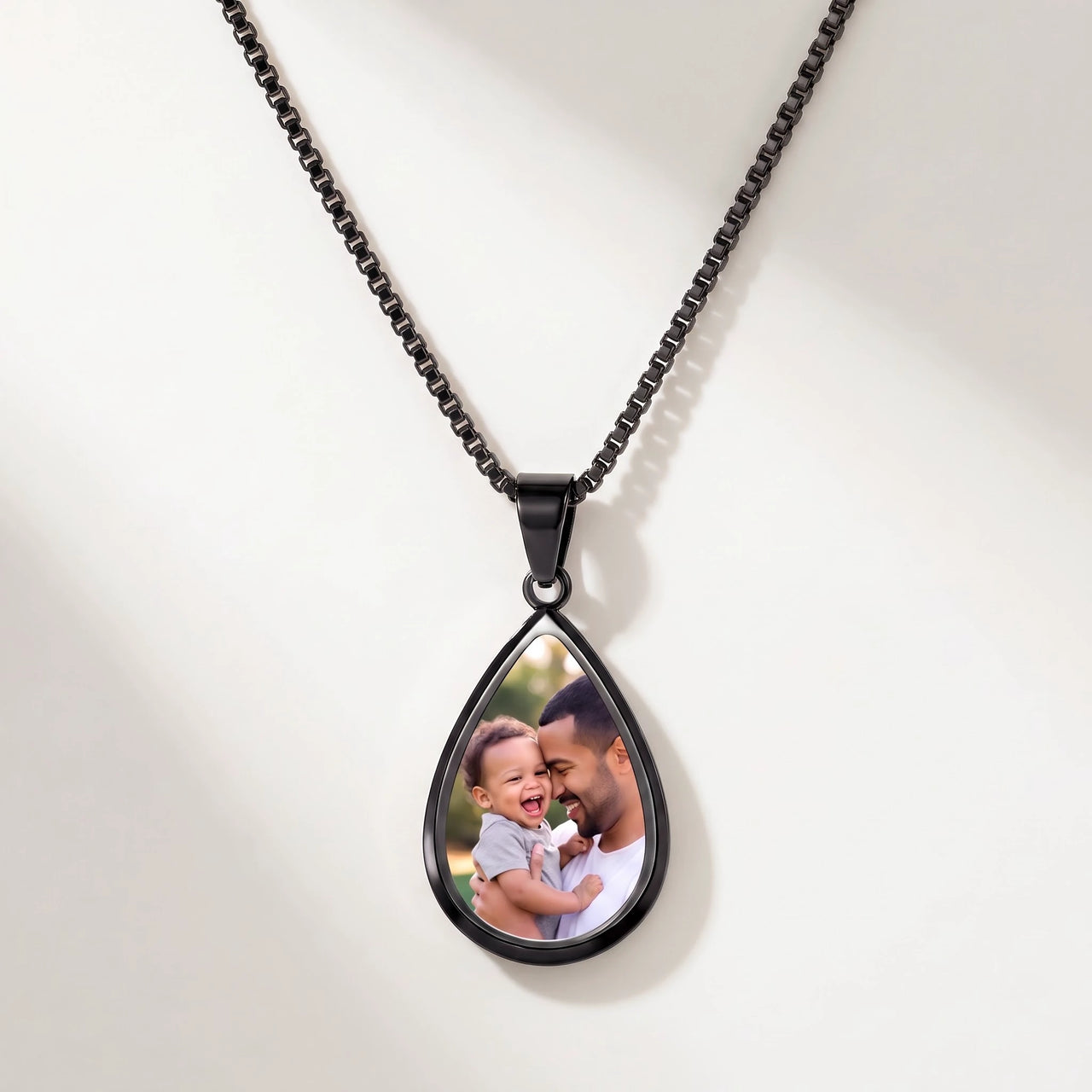 Secret Drop Photo Necklace in black, teardrop pendant on a box chain showing the hidden photo | SKU: TPH-DRPN-BLACK