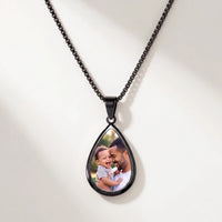 Thumbnail for Secret Drop Photo Necklace in black, teardrop pendant on a box chain showing the hidden photo | SKU: TPH-DRPN-BLACK