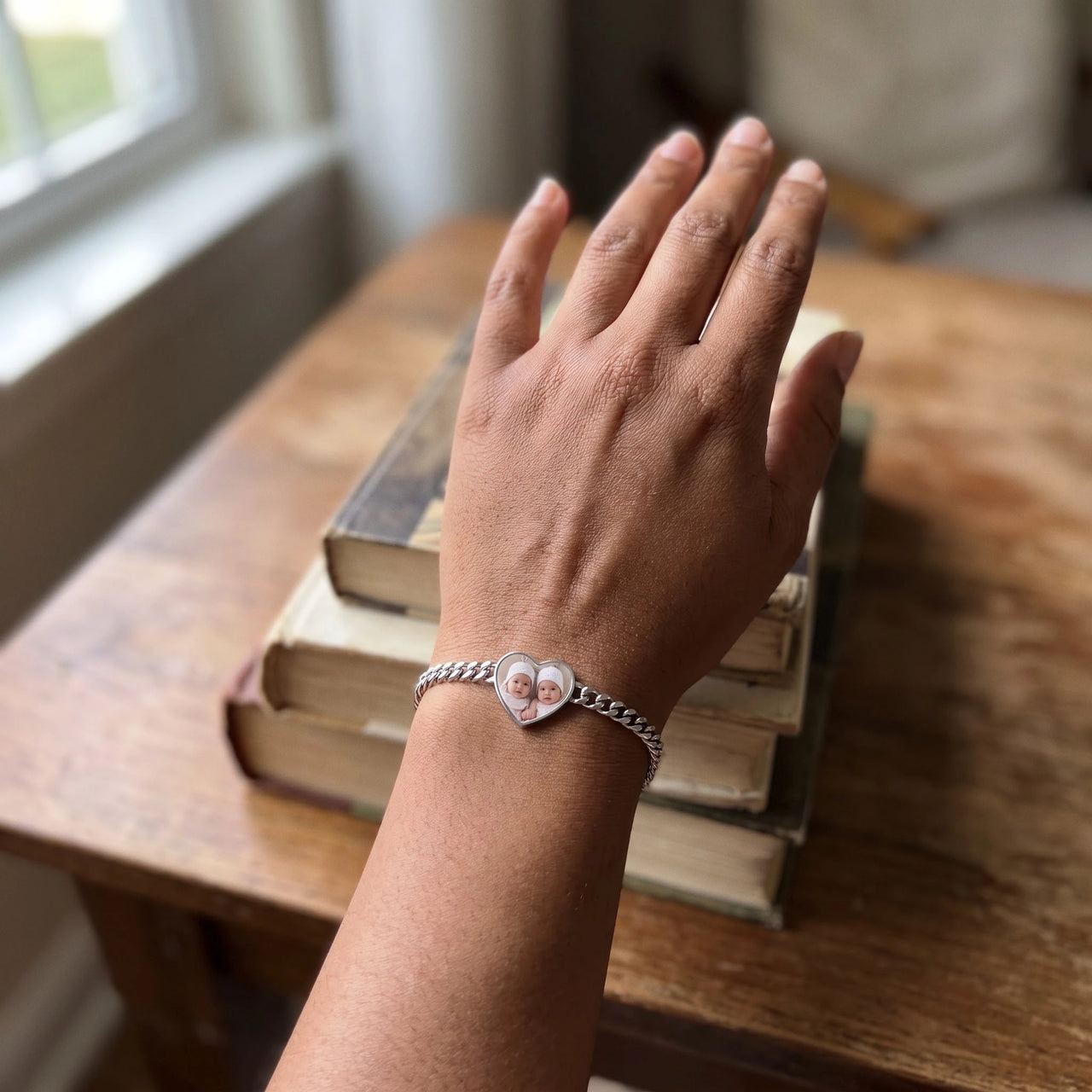 The silver heart photo bracelet on her wrist, showing its real small size | SKU: TPH-HRTB-SILVER