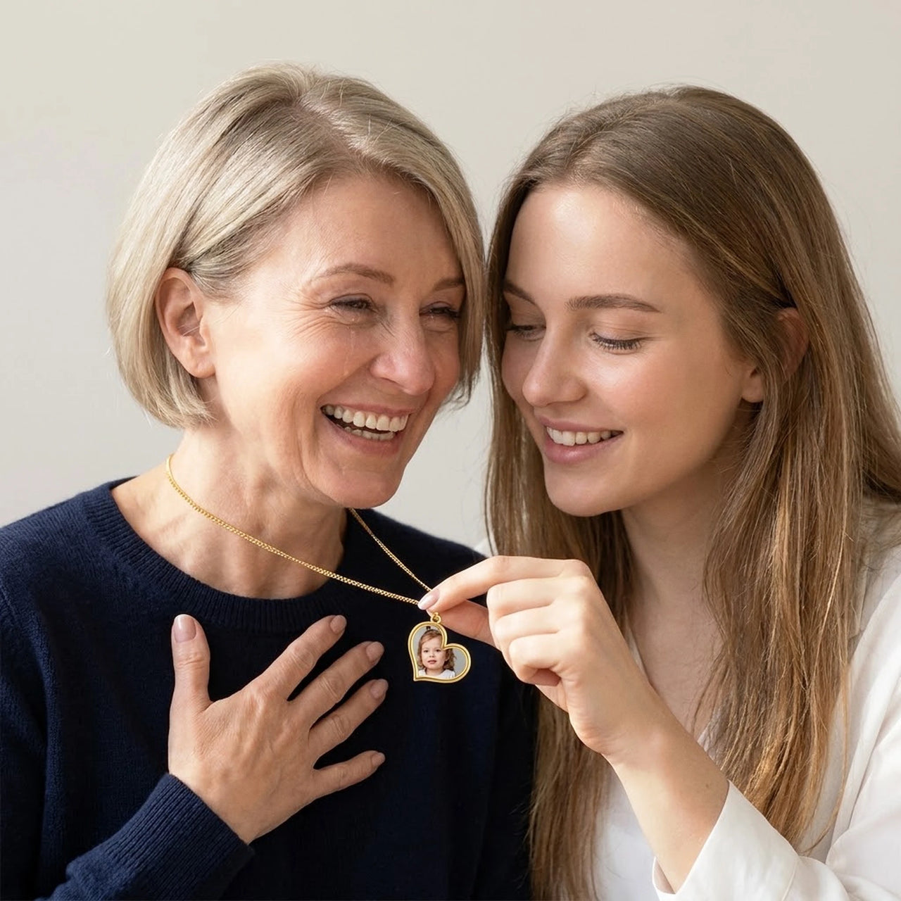 Daughter showing her mother the childhood photo hidden in the gold heart necklace | SKU: TPH-HRTN-GOLD