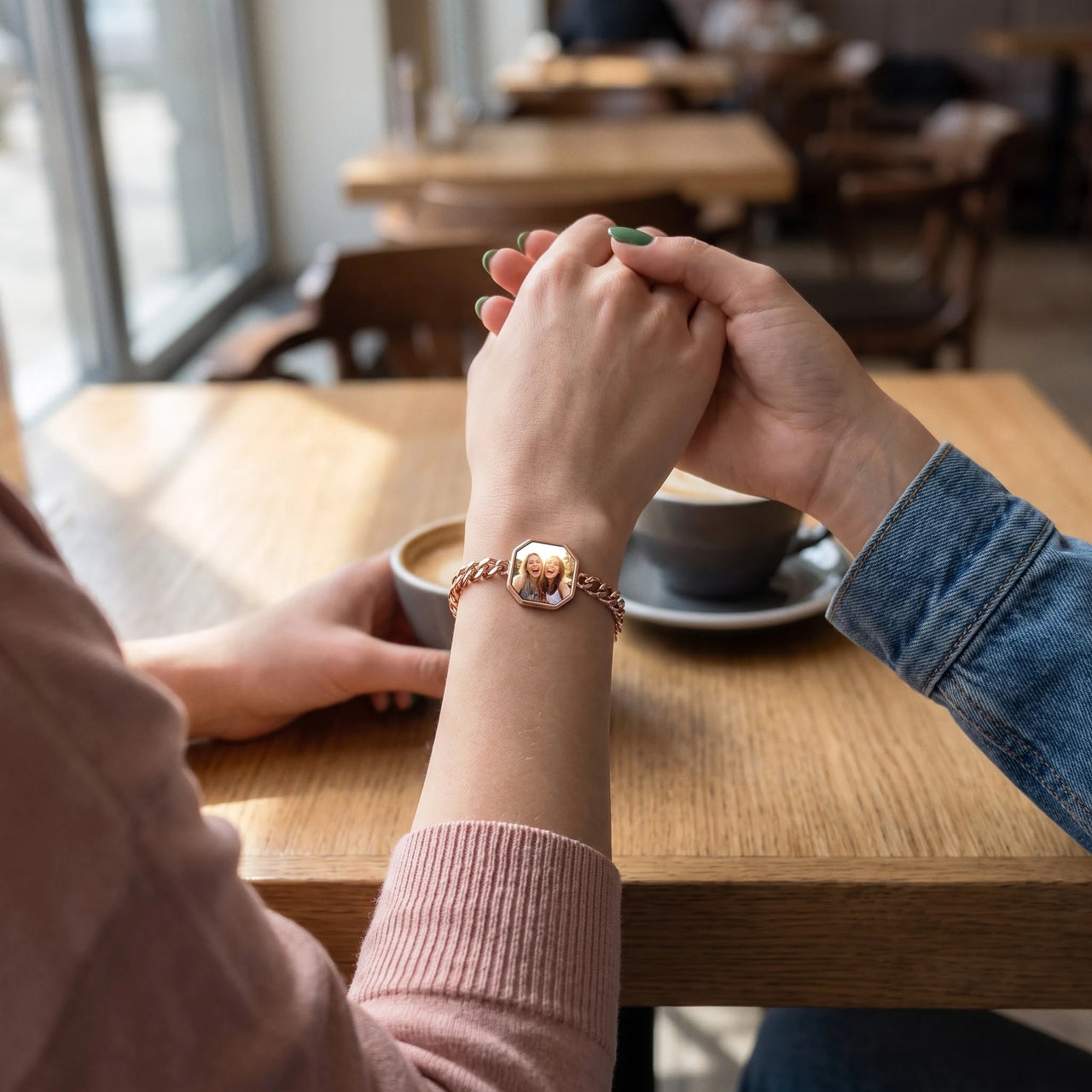 Two friends holding hands over coffee, the rose gold octagon photo bracelet on her wrist | SKU: TPH-OCTB-ROSEGOLD-18