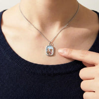 Thumbnail for Looking down at the silver oval pendant, real small size, her children's photo inside | SKU: TPH-OVLN-SILVER