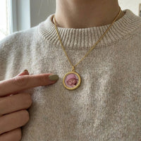 Thumbnail for Looking down at the gold round pendant worn on her chest, real small size | SKU: TPH-RNDN-GOLD