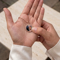 Thumbnail for Thumb warming the rose gold round pendant: the hidden photo appears under the thumb while the rest stays black | SKU: TPH-RNDN-ROSEGOLD