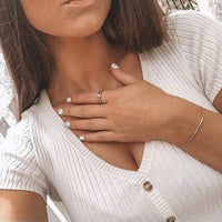 Thumbnail for Engagement Ring with Crystals in rose gold worn, hand resting on the chest | SKU: 25535390-5-rose-gold